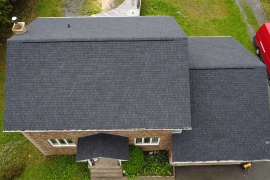 Completed residential roof replacement with architectural shingles