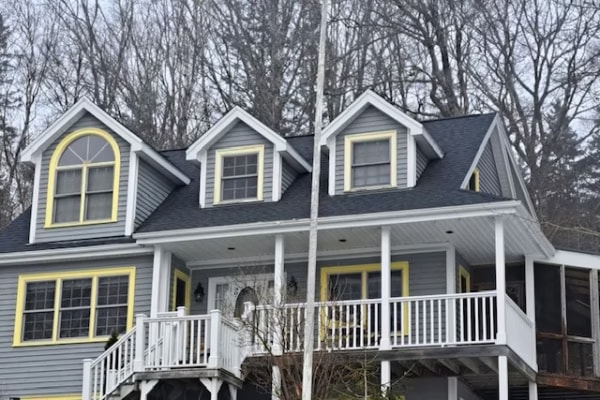 Roofing contractors working on residential roof